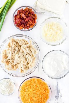 the ingredients for this chicken salad are laid out in separate bowls