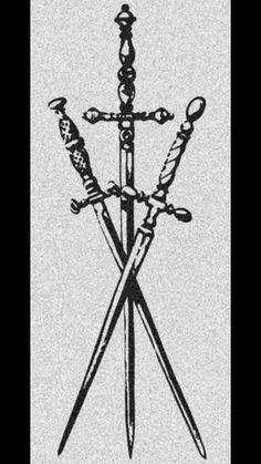 two crossed swords are standing next to each other with knives in the middle one is black and white