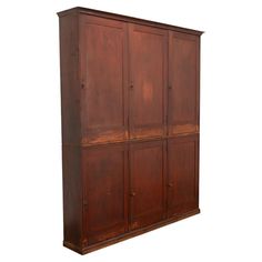 an old wooden cabinet with six doors