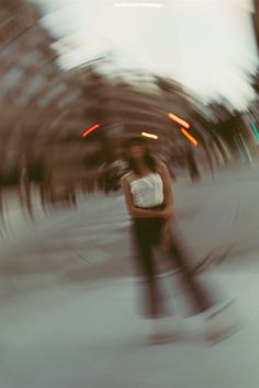 a blurry photo of a person standing in the street