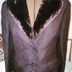 This coat is stunning.It looks like it's not been worn.British designer Alexander Milne Pure Virgin Wool with Faux fur brown collar.Not removable.It is in great condition.It is a size 6-8 US and small -medium.Luxury Designer Coat for women.See photos for label.It is clean and ready to wear.Looks purple but it's a warm two tone brown.Coat measures: chest 19 inches back shoulders 14 inches sleeve is 23 inches waist is 19 inches  full length is 41 inches that includes the collar.2 pockets are deep Knee Length Coat, Brown Coat, Coat Design, Back Shoulder, Faux Fur Collar, Fur Collar, Fur Collars, Wool Coat, Luxury Designer