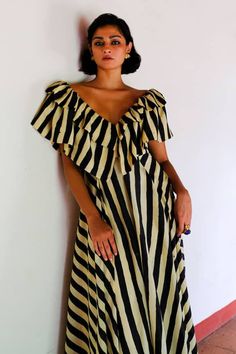 Beige midi dress with stripe print with ruffled yoke. - Aza Fashions Chic Striped Maxi Dress, Spring Striped Dresses With Ruffles, Chic Vertical Stripes Dress For Day Out, Chic Day Out Dress With Vertical Stripes, Vertical Stripes Midi Dress For Vacation, Chic Vertical Stripes Midi Dress For Beach, Elegant Striped Midi Dress For Vacation, Chic Midi Dress With Vertical Stripes For Beach, Chic Maxi Dress With Vertical Stripes