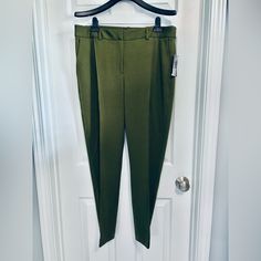 Brand New With Tags! Please See The Pics! Retail $99 Any Additional Questions, Pics, Etc Just Ask...Thanks For Looking!!! Brand/Specifics: Bnwt Women's Tahari Asl Pointe Ankle Pants-Slim Olive Green Mid Rise Front Seam Us Size 14 Waist 16" To 18" - Rise 13" - Hip 22" - Inseam 28" - Leg Opening 7" Tahari Asl Women's Mid-Rise Front-Seam Ponte Ankle Pants The Perfect Blend Of Comfort And Sophistication From Tahari Asl These Women's Pants Effortlessly Elevate Your Work Attire With Their Sleek Design Green Tapered Leg Pants For Office, Green Tapered Leg Bottoms For Office, Green Ankle-length Elastane Pants, Green Fitted Ankle-length Pants, Fitted Green Ankle-length Pants, Green Tapered Leg Elastane Pants, Fitted Ankle-length Green Pants, Green Tapered Leg Dress Pants For Fall, Khaki Uniform Pants