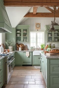 a kitchen filled with lots of green cabinets