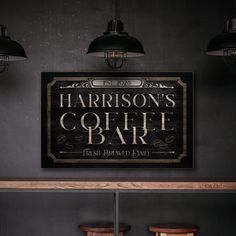 a bar with three stools and a sign on the wall that says harrison's colerf