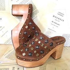 Free People Claudia Platform Brass Studded Clogs Brown Suede Wood Fancy Studs With Studded Base New Without Box * Size: 38 / 8 1.75" Platform * 4" Heel Please Note Line Through Tag To Prevent Store Return Brown Closed Toe Clogs With Studded Outsoles, Brown Closed Toe Mules With Studded Rubber Outsoles, Vintage Leather Sole Clogs For Spring, Vintage Clogs With Stacked Heel For Spring, Spring High Heel Clogs With Studded Rubber Outsoles, Vintage Spring Clogs With Stacked Heel, Studded Clogs, Free People Shoes, Wood Color