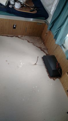 a room that has been torn apart and is in need of some work on the floor