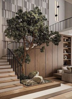 a living room filled with furniture and a tree in the middle of the flooring