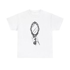 a white t - shirt with a black and white drawing of a mirror on it