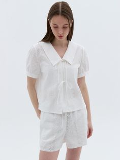 Blouse in airy, woven cotton fabric with eyelet embroidery. Collar, front-tie with button closure, and short sleeves.- Regular fit- Collar- Short sleeve Summer Collared Broderie Anglaise Tops, Summer Broderie Anglaise Collared Tops, Spring Broderie Anglaise Short Sleeve Blouse, Feminine Short Sleeve Eyelet Blouse, Short Sleeve Broderie Anglaise Blouse For Daywear, Short Sleeve Blouse With Broderie Anglaise For Daywear, My Photo Gallery, Cotton Weaving, Ribbon