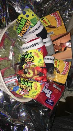 a bucket filled with chips and snacks on top of a table