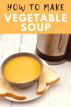 a bowl of soup on a plate with bread