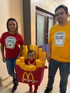 two adults and a child wearing mcdonald's shirts