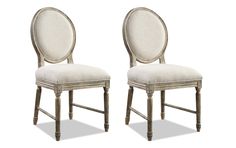 two chairs with white linen upholstered on the back and sides, one in grey