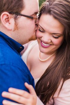 a man and woman cuddle close to each other