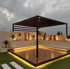 an outdoor area with lights and seating