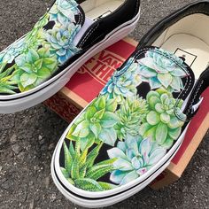 These Black Slip On Vans have various watercolor-inspired succulents on the tops of both shoes. These slip on's are perfect for succulent lovers! We buy each pair of shoes BRAND NEW. Each pair is made to order, please make sure you put in the correct shoe size before you check out. The ink is permanent and will never come off, fade away, or peel off. Made in the USA. This price includes everything: shoes and artwork. Each pair of shoes is made-to-order and takes 3 - 4 weeks to ship usually. Beca Vans Art Shoes, Painted Vans Slip On, Painted Apparel, Custom Slip On Vans, Black Slip On Vans, Painting Shoes, Succulent Painting, Apple Watch Bands Fashion, Painted Canvas Shoes