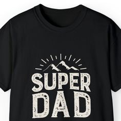 Show your appreciation for the super dad in your life with our 'Super Dad Men's Tee.' This stylish and comfortable Father's Day T-shirt features a striking mountain landscape background, making it the perfect gift for adventurous dads. Whether he's conquering mountains or simply being the superhero dad at home, this tee celebrates his strength and love. Available in various sizes, it's a thoughtful and meaningful gift for Father's Day or any occasion. Order yours today and let your super dad wea Mountain Tee, Landscape Background, Super Dad, Father's Day T Shirts, Mountain Landscape, Gifts For Father, Meaningful Gifts, Mens Tees, Fathers Day Gifts