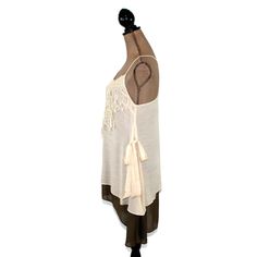 This layered dress features spaghetti straps crossed at the back and a romantic boho, mori vibe. The lace applique on the bodice and side ties also add a 20's style flapper feel to this unique loose fitting chemise. I love the creamy beige and brown combo and the high low hemline. Also available in Blue/Gray here: https://www.etsy.com/listing/656680524/romantic-clothes-layered-dress-boho-mini?ref=shop_home_active_7 Each piece in our HEART ALTERED collection has been embellished with our signatur Bohemian V-neck Camisole For Beach, Bohemian Sleeveless Dress For Layering, Bohemian Lace Camisole For Spring, Spring Bohemian Lace Camisole, Bohemian Cami Dress For Vacation, Lace Camisole With Spaghetti Straps For The Beach, Bohemian Spaghetti Strap Dress With Crochet Trim, Bohemian Dress With Crochet Trim And Spaghetti Straps, Beach Camisole With Spaghetti Straps And Tie Back