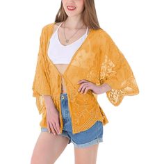 Add a touch of boho flair to your outfit with the Anna-Kaci Women's Short Embroidered Lace Duster Crop Cardigan with Half Sleeves. Blending just the right amount of and modesty, this lace duster keeps your arms and shoulders covered while allowing your outfit to shine through with its sheer lace design. The loose fit, open front, and extra-large armholes ensure a comfortable fit for any body type, creating a dramatic and head-turning flowy look as you walk by. Bohemian V-neck Summer Outerwear, Spring Hippie Outerwear For Vacation, Hippie Outerwear For Spring Vacation, Bohemian Cardigan For Beach Cover-up In Fall, Summer Hippie Outerwear For Vacation, Hippie Summer Outerwear For Vacation, Summer Hippie Vacation Outerwear, Bohemian V-neck Outerwear For The Beach, Fall Festival Open Front Tops