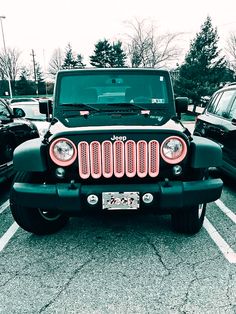 a black jeep parked in a parking lot