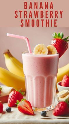 a banana strawberry smoothie in a glass with strawberries and bananas