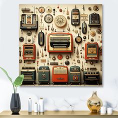 an old fashioned radio and other electronic devices on a wall above a table with vases