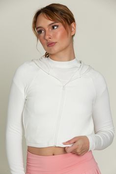 This buttery softy and unbelievably comfortable jacket is the lounge staple you've been missing. Our Ivory Ribbed Hoodie Jacket is complete with a hood, full zip closure and side pockets for holding the essentials. Pair this jacket with our Ivory Short Sleeve Ribbed Tee for a more cohesive look. White Long Sleeve Hooded Jacket For Loungewear, Solid Athleisure Hooded Jacket For Loungewear, Athleisure Hooded Jacket For Loungewear, Solid Color Athleisure Hooded Jacket For Loungewear, Cozy White Hooded Jacket With Adjustable Hood, Solid Outerwear With Adjustable Hood For Loungewear, Loungewear Outerwear With Adjustable Hood, White Outerwear With Drawstring Hood For Loungewear, White Drawstring Hood Outerwear For Loungewear