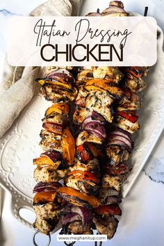 chicken and vegetable kabobs on a white plate with text overlay that reads, italian dressing chicken