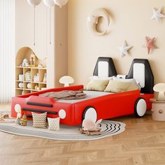 a child's bedroom with a red car bed