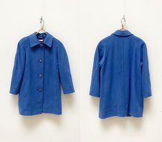 "Vintage 90s Lampert London Blue Coat Women Blue Coat Pastel Blue Jacket Virgin Wool Coat Small Blue Warm Coat Blue Midi Coat Women Coat S D E S C R I P T I O N: 💙 medium weight 💙 2 side pockets 💙 4 buttons closure 💙 virgin wool Brand: Lampert London Suggested size: UK 10, USA 8, EUR 36, looks like women's S or oversize - to ensure a good fit, please check the below measurements carefully. Material: 80 % virgin wool 20 % nylon Made in: England 🧵 M E A S U R E M E N T S 💙Measurements - taken from seam to seam while the garment is lying flat. Please, DOUBLE bust, waist, hips, bottom hem, and sleeve hem!💙 Bust: 19.7\" / 50 cm Waist: 19.3\" / 49 cm Bottom hem: 22\" / 56 cm Sleeve length: 25.2\" / 64 cm (from neckline)  Sleeve hem: 6.3\" / 16 cm Length: 31.1\" / 79 cm (back neckline to b Vintage Blue Blazer For Workwear, Vintage Blue Long Sleeve Blazer, Retro Blue Outerwear With Buttons, Winter Blue Collared Blazer, Vintage Blue Blazer With Button Closure, Blue Retro Long Sleeve Blazer, Blue Long Sleeve Retro Blazer, Vintage Blue Single Breasted Outerwear, Vintage Blue Single-breasted Outerwear