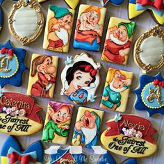 decorated cookies with snow white and the seven dwarfs on them