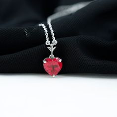 Product Details Experience the elegance of simplicity with this Created Ruby Heart Necklace, symbolizing courage and unshakable willpower in life. Adorned with a classic heart-shaped Created Ruby in a prong setting, this created ruby necklace is the perfect accessory for your wedding anniversary or any special occasion. Product Information SKU SHP-PENDANT042167670 Weight 3.75 gm (Approximate) LAB CREATED RUBY INFORMATION No.of Stones 1 Pieces Total Weight 2.00 Carat (Approximate) Dimension(appro Ruby Heart Necklace, Ruby Heart, Solitaire Necklace, Ruby Necklace, Solitaire Necklaces, Signature Jewelry, Timeless Jewelry, List Style, Font Size