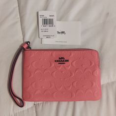 Coral Colored Coach Wristlet. Such A Cute Vibrant Color. Perfect Condition Brand New. Tags Included Trendy Coach Clutch As Gift, Trendy Wristlet With Zipper Pouch, Pink Pouch Wristlet With Strap, Trendy Coach Wristlet As Gift, Pink Pouch Wristlet With Wrist Strap, Pink Rectangular Wristlet With Wrist Strap, Pink Coach Pouch Wristlet, Coach Rectangular Wristlet With Zipper Pouch, Coach Wristlet For Daily Use