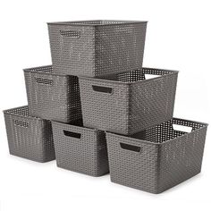 six grey storage baskets stacked on top of each other