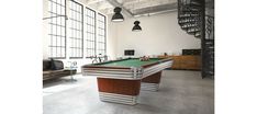 a pool table in the middle of a room