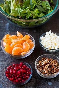 several bowls filled with different types of food