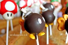 chocolate covered marshmallows are arranged on sticks