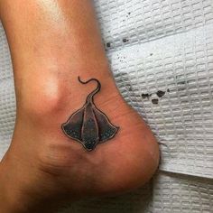 a tattoo on the foot of a woman