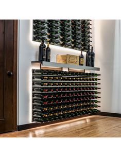 a wine rack with many bottles on it