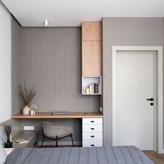 a bedroom with a bed, desk and shelves on the wall next to it's door