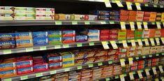 shelves in a grocery store filled with lots of food