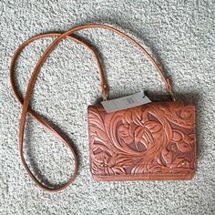 Beautiful Crossbody Bag Nwt Retails For $54! Lots Of Slots For Cards, A Couple Zipper Pouches And One Regular Open Pouch. Beautiful Leaf Design! Little Blemish On The Gold Button See Pictures. Bundle And Save! Tan Clutch For Everyday Use, 90s Bag, Small Sling Bag, Tassel Purse, Juicy Couture Purse, Crossover Bags, Brown Leather Crossbody Bag, Zipper Pouches, Black Crossbody Purse