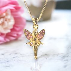 This fairy princess gold necklace is beautifully crafted with pink jewels on the wings. A fabulous gift idea. Gold chain. Suitable for children age 3 and over. Chain length 71/2 in. Baby Bible, Earth Baby, Pink Jewels, Fairy Necklace, Fairy Princess, Fairy Princesses, The Wings, Mini Wallet