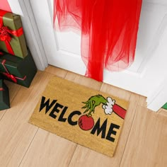 The Grinch coir welcome mat is a playful and whimsical addition to your home, inspired by the iconic character from Dr. Seuss' "How the Grinch Stole Christmas!" This festive mat combines functionality with a delightful design that captures the mischievous spirit of the Grinch. Made from natural coir fibers, derived from coconut husks, the surface of the mat offers excellent scraping properties. As visitors step on the mat, the coir fibers effectively remove dirt, mud, and debris from their shoes Grinch Welcome Mat, Grinch Porch Ideas, Grinch Door Mat, Grinch Front Porch Decorations, Grinch Outdoor Christmas Decorations, Grinch Doormat, Grinch Home Decor, The Grinch Christmas Decorations, Christmas Decor Grinch