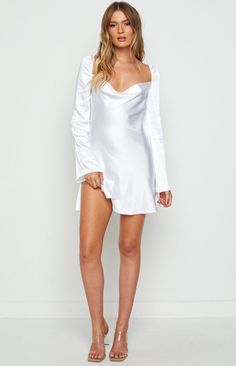 White Long Sleeve Dress

You'll party the night away in this gorg white long sleeve mini! The soft, silky fabric will make you look and feel elegant AF! Style with dangly gold earrings  a layered necklace and heels to complete your look

Mini length

Long Sleeves

Flared Sleeve

Invisible zip at side

Cowl neckline

Elasticated shoulder

Low back

Tie up string at back shoulders

Lined bust - unlined elsewhere

Mid-weight satin-like material without stress Dangly Gold Earrings, Prom Midi Dress, Feminine Elegance, Summer Playsuit, White Long Sleeve Dress, Silky Fabric, Mini Robes, Beginning Boutique, Strapless Tops