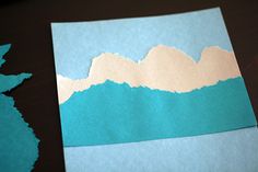 a piece of paper cut out to look like mountains