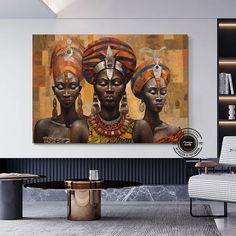 two african women with headdresses in front of a painting on the wall