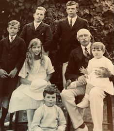 an old black and white photo of a family