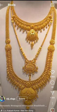 an elaborate gold necklace on display in a store